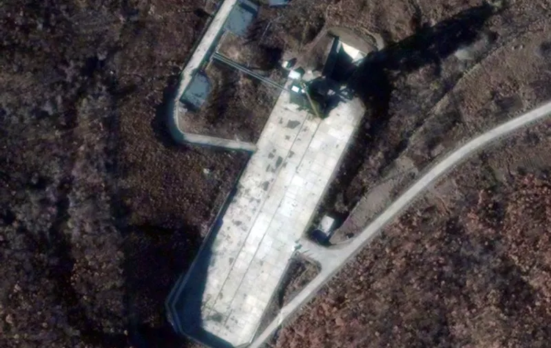 This satellite image courtesy of DigitalGlobe of the Sohae Launch Facility on November 26, 2012, shows a marked increase in activity at North Korea's Sohae (West Sea) Satellite Launch Station. This activity is consistent with launch preparations as witnessed prior to the failed April 13, 2012 launch of the Unha 3 (i.e., Universe or Galaxy 3) space launch vehicle (SLV) carrying the Kwangmyongsong 3 (i.e., Bright Lodestar 3). Given the observed level of activity noted of a new tent, trucks, people and portable fuel/oxidizer tanks, should North Korea desire- it could possibly conduct its fifth satellite launch event during the next three weeks (e.g., by mid-December 2012).  = RESTRICTED TO EDITORIAL USE - MANDATORY CREDIT " AFP PHOTO / DIGITALGLOBE VIA GETTY IMAGES/" - NO MARKETING NO ADVERTISING CAMPAIGNS - DISTRIBUTED AS A SERVICE TO CLIENTS = / AFP PHOTO / DIGITALGLOBE / DIGITALGLOBE