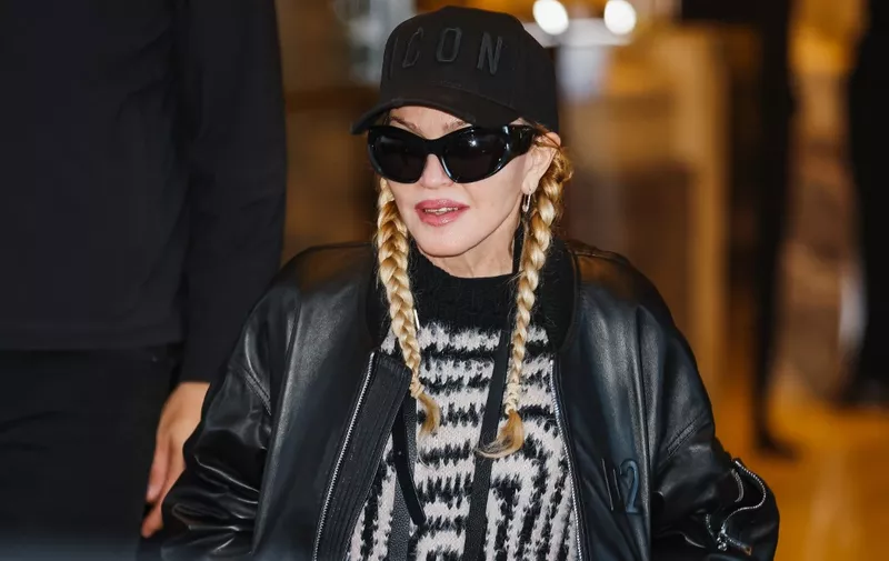 Madonna is leaving her hotel in Milan, Italy, on November 25, 2023. (Photo by Alessandro Bremec/NurPhoto) (Photo by Alessandro Bremec / NurPhoto / NurPhoto via AFP)