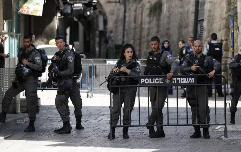Israeli security forces stand guard at one of the entrances to Al Aqsa mosque compound in the Jerusalem's Old City on July 14, 2017, following an alleged attack.
Three assailants opened fire on Israeli police in Jerusalem's Old City before fleeing to a nearby highly sensitive holy site and being killed by security forces, Israeli police said. / AFP PHOTO / Ahmad GHARABLI