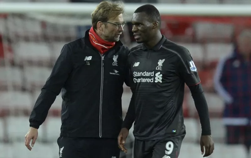 Liverpool's German manager Jurgen Klopp (L) talks with goalscorer Liverpool's Zaire-born Belgian striker Christian Benteke (R) after the final whistle in the English Premier League football match between Sunderland and Liverpool at the Stadium of Light in Sunderland, north east England, on December 30, 2015. AFP PHOTO / OLI SCARFF

RESTRICTED TO EDITORIAL USE. No use with unauthorized audio, video, data, fixture lists, club/league logos or 'live' services. Online in-match use limited to 75 images, no video emulation. No use in betting, games or single club/league/player publications. / AFP / OLI SCARFF