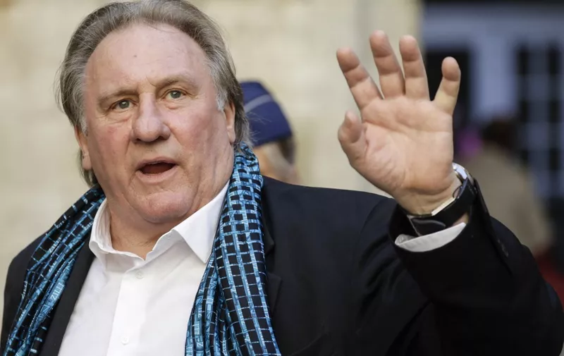 (FILES) In this file photo taken on June 25, 2018, French actor Gerard Depardieu waves as he arrives at the Town Hall in Brussels for a ceremony as part of the 'Brussels International Film Festival' (Briff). Nearly 60 French actors and other prominent figures have denounced the "lynching" of disgraced cinema legend Gerard Depardieu, who is charged with rape and facing a litany of sexual assault claims. "Gerard Depardieu is probably the greatest of all actors," said an open letter published in French newspaper Le Figaro late on December 25, 2023, Christmas Day. (Photo by THIERRY ROGE / BELGA / AFP) / Belgium OUT