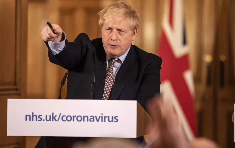 Prime Minister Boris Johnson gives a press conference on the ongoing COVID-19 situation in London on March 16, 2020. (Photo by Richard Pohle / POOL / AFP)
