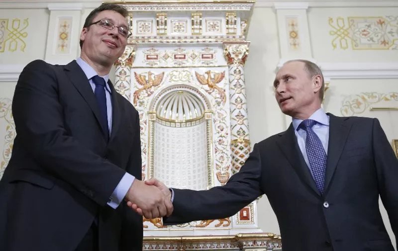 Russia's President Vladimir Putin (R) welcomes Serbian Prime Minister Aleksandar Vucic (L) during their meeting in the Novo-Ogaryovo residence, outside Moscow, on July 8, 2014. Russia and Serbia are ready to start procedures of signing an agreement on the South Stream gas pipeline in the next few days, the Itar-TASS news agency quoted Russia's Prime Minister Dmitry Medvedev as saying yesterday after his talks with Vucic. The 16-billion-euro ($21.8 billion) South Stream pipeline would stretch nearly 2,500 kilometres (1,500 miles) from Russia under the Black Sea to Bulgaria, Serbia, Hungary and Slovenia before reaching a terminal in Italy. It is an attempt to reduce Moscow's reliance on Ukraine as a transit country for its natural gas following disputes with Kiev in 2006 and 2009 that led to interruptions of gas supplies to Europe. AFP PHOTO / POOL/ MAXIM SHIPENKOV / AFP PHOTO / POOL / MAXIM SHIPENKOV