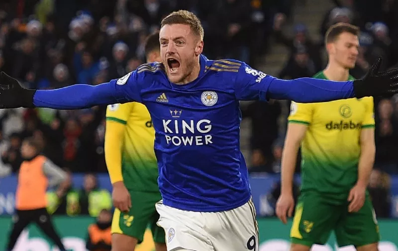Leicester City's English striker Jamie Vardy celebrates after scoring their first goal during the English Premier League football match between Leicester City and Norwich City at King Power Stadium in Leicester, central England on December 14, 2019. (Photo by Oli SCARFF / AFP) / RESTRICTED TO EDITORIAL USE. No use with unauthorized audio, video, data, fixture lists, club/league logos or 'live' services. Online in-match use limited to 120 images. An additional 40 images may be used in extra time. No video emulation. Social media in-match use limited to 120 images. An additional 40 images may be used in extra time. No use in betting publications, games or single club/league/player publications. /
