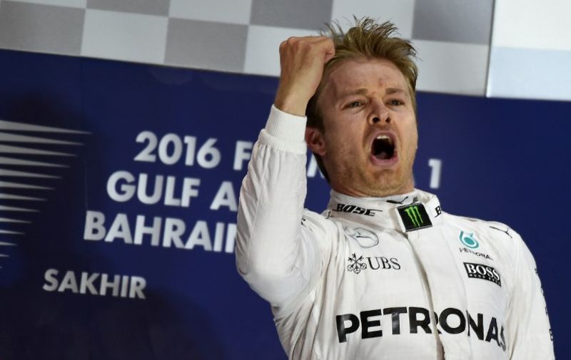 Mercedes AMG Petronas F1 Team's German driver Nico Rosberg celebrates on the podium after winning the Bahrain Formula One Grand Prix at the Sakhir circuit in Manama on April 3, 2016.  AFP PHOTO / MOHAMMED AL-SHAIKH / AFP / MOHAMMED AL-SHAIKH