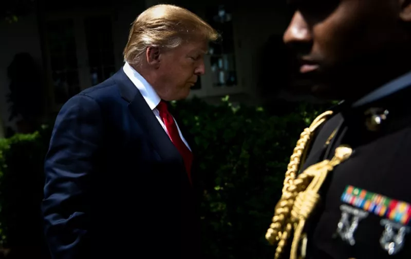 US President Donald Trump leaves after a ceremony celebrating West Point's football team in the Rose Garden of the White House May 6, 2019, in Washington, DC. (Photo by Brendan Smialowski / AFP)