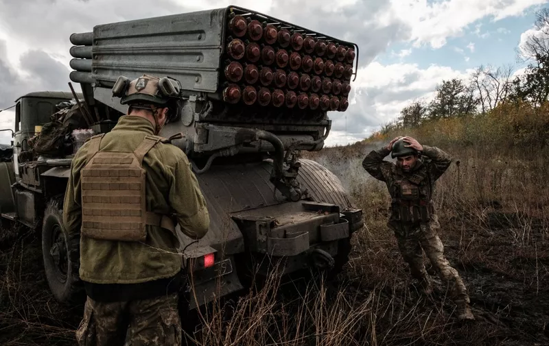 Ukrainian soldiers prepare to fire a BM-21 'Grad' multiple rocket launcher towards Russian positions in Kharkiv region on October 4, 2022. (Photo by Yasuyoshi CHIBA / AFP)