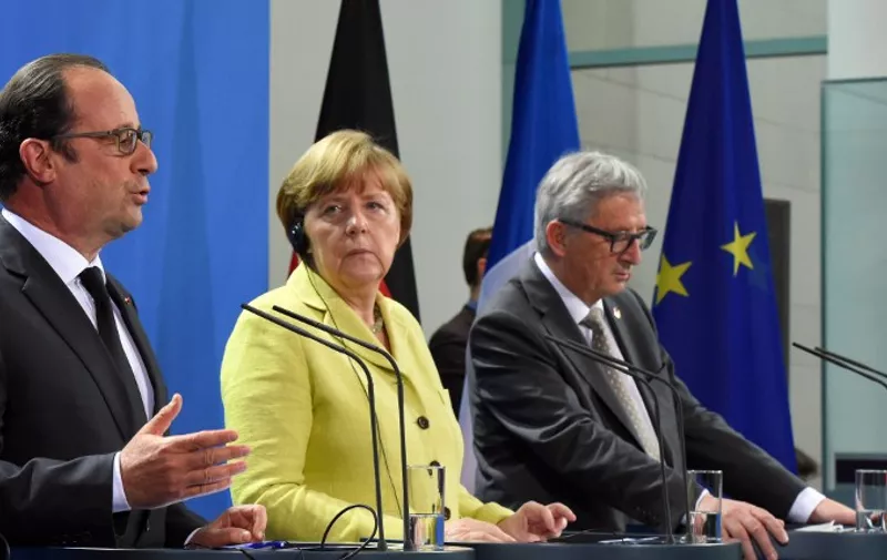 (L-R) French President Francois Hollande, German Chancellor Angela Merkel and European Commission President Jean-Claude Juncker address a press conference prior to talks with representatives of the of the European Round Table of Industrialists (ERT) on June 1, 2015 at the Chancellery in Berlin. The mini-summit brings the leaders of the eurozone's two biggest economies together with around 20 heads of large European companies to discuss the Greek debt crisis, the threat of Britain leaving the EU and economic challenges.      AFP PHOTO / TOBIAS SCHWARZ
