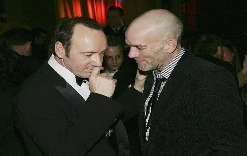 NEW YORK - DECEMBER 8: (U.S. TABS AND HOLLYWOOD REPORTER OUT)  Actor Kevin Spacey chats with singer Michael Stipe of R.E.M. at the "Beyond The Sea" New York premiere afterparty at the Starlight Room in the Waldorf-Astoria Hotel December 8, 2004 in New York City. (Photo by Evan Agostini/Getty Images) *** Local Caption *** Kevin Spacey;Michael Stipe