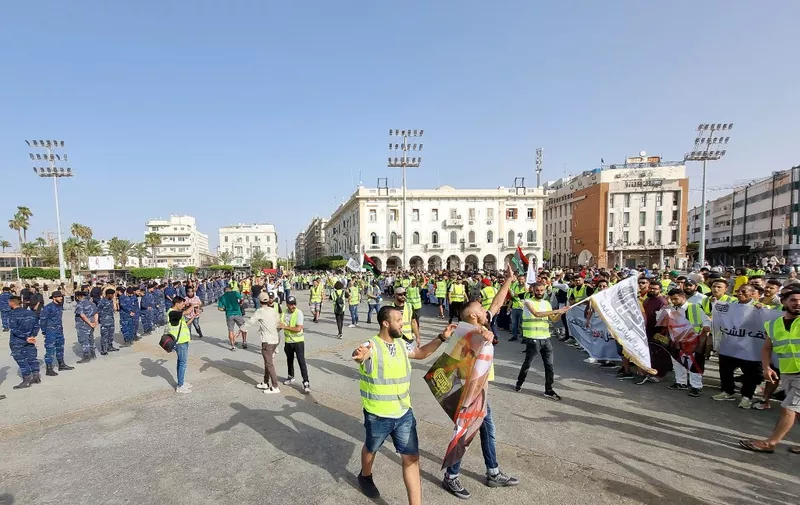 Libyans gather at the Martyrs' Square of Libya's capital Tripoli on July 1, 2022, to protest against the political situation and dire living conditions. (Photo by Mahmud TURKIA / AFP)