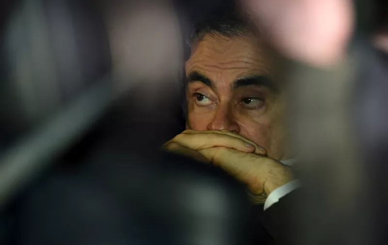 (FILES) This file photo taken on March 6, 2019 shows former Nissan chairman Carlos Ghosn leaving his lawyers' offices after he was released earlier in the day from a detention centre after posting bail in Tokyo. - Carlos Ghosn's escape from Japan is "unjustifiable" and he is thought to have left the country using "illegal methods", the Japanese justice minister said on January 5, 2020, in the first official public comments on the case. (Photo by Kazuhiro NOGI / AFP)