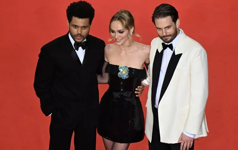 (From L) Canadian singer Abel Makkonen Tesfaye aka The Weeknd, French-US actress Lily-Rose Depp and US director Sam Levinson arrive for the screening of the film "The Idol" during the 76th edition of the Cannes Film Festival in Cannes, southern France, on May 22, 2023. (Photo by Antonin THUILLIER / AFP)