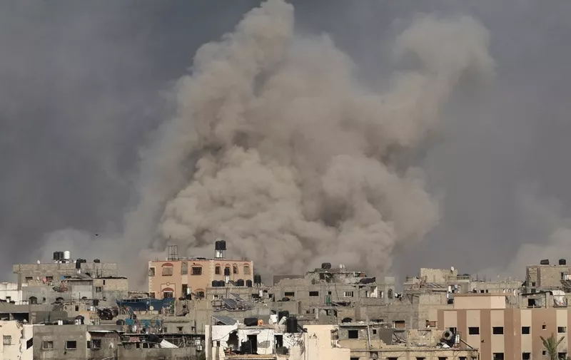 Smoke billows after an Israeli strike on Jabalia as seen from Beit Lahia, in the northern Gaza Strip on May 19, 2024, amid the ongoing conflict between Israel and the militant Hamas group. (Photo by AFP)
