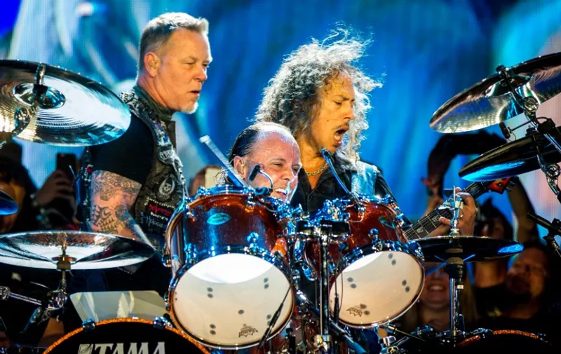 LAS VEGAS, NV - MAY 08: (L-R) Musicians James Hetfield, Lars Ulrich and Kirk Hammett of Metallica perform onstage during Rock in Rio USA at the MGM Resorts Festival Grounds on May 8, 2015 in Las Vegas, Nevada.   Christopher Polk/Getty Images/AFP