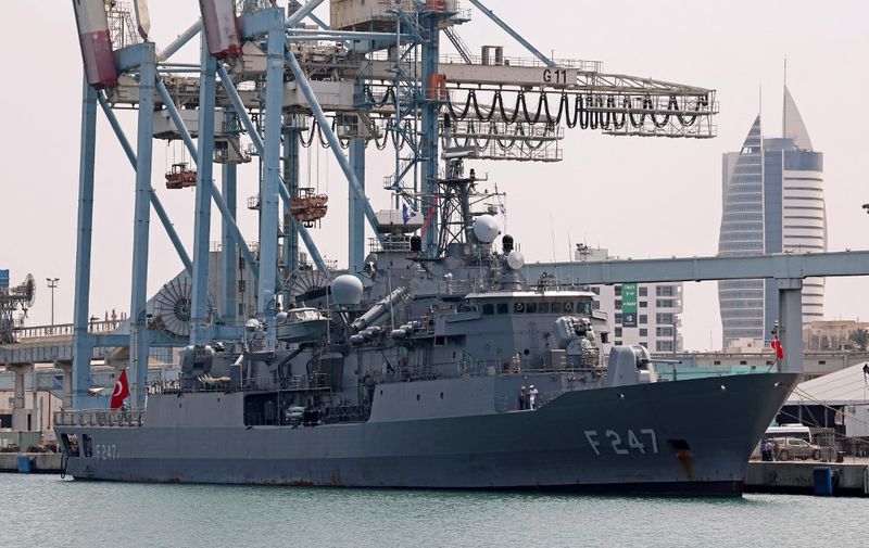 The Turkish Navy Turkish frigate (F-247) TCG Kemalreis (C) docks at Israel's northern port of Haifa during a NATO naval exercise on September 3, 2022. - The TCG Kemalreis is the first Turkish naval ship to arrive in Israel since ties ruptured in 2010, following a confrontation between Israeli special forces and Turkish peace activists aboard a civilian vessel that had tried to breach the naval blockade on the Gaza Strip. The ship, along with other NATO vessels, are expected to remain in Israel for several days. (Photo by JACK GUEZ / AFP)