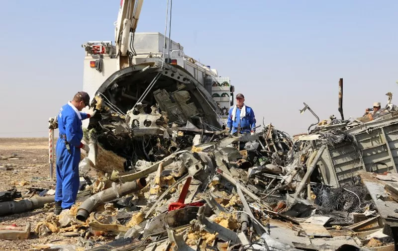 A handout picture taken on November 2, 2015 and released on November 3, 2015 by Russia's Emergency Ministry shows Russian emergency services personnel working at the crash site of a A321 Russian airliner in Wadi al-Zolomat, a mountainous area of Egypt's Sinai Peninsula. Russian airline Kogalymavia's flight 9268 crashed en route from Sharm el-Sheikh to Saint Petersburg on October 31, killing all 224 people on board, the vast majority of them Russian tourists. AFP PHOTO / RUSSIA'S EMERGENCY MINISTRY
*RESTRICTED TO EDITORIAL USE - MANDATORY CREDIT "AFP PHOTO / RUSSIA'S EMERGENCY MINISTRY" - NO MARKETING NO ADVERTISING CAMPAIGNS - DISTRIBUTED AS A SERVICE TO CLIENTS *