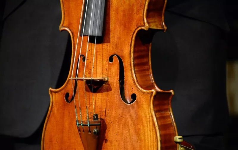 A picture shows the "Macdonald" Stradivarius viola created in 1719 by Antonio Stradivari (1641-1737), at Sotheby's auction house in Paris on April 15, 2014. Sotheby's announced the sale of the viola for this spring 2014 in New York, estimated to sell in excess of 45 million US dollars.  AFP PHOTO BERTRAND GUAY / AFP PHOTO / BERTRAND GUAY