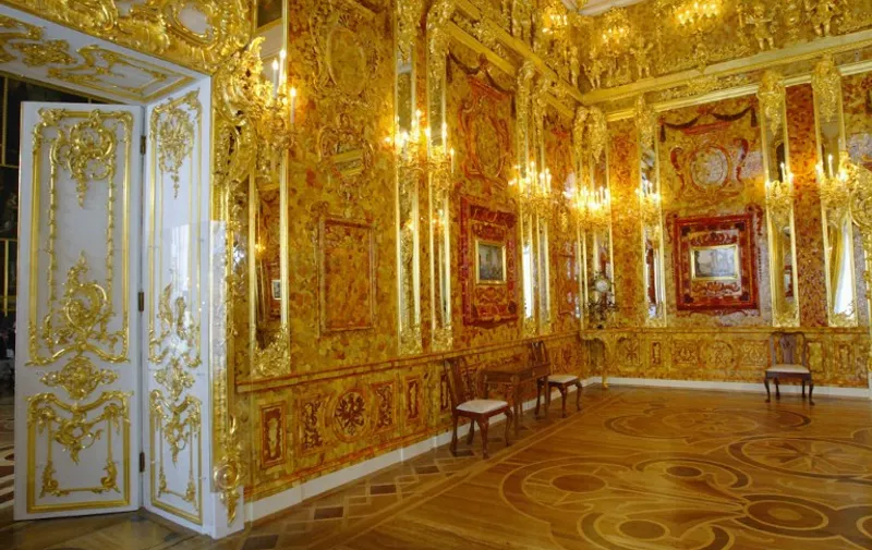 View of the Amber Room just before its opening after a complete restoration in the Catherine Palace in St. Petersburg,31 May 2003. The Russian President Vladimir Putin and German Chancellor Gerhard Schroeder on Saturday officially opened the painstakingly recreated Amber Room, a chamber in the Catherine Palace in the suburb of Tsarskoye Selo that was lost after German troops dismantled and carted it off during World War II.  AFP PHOTO/POOL/Alexander Zemlianichenko