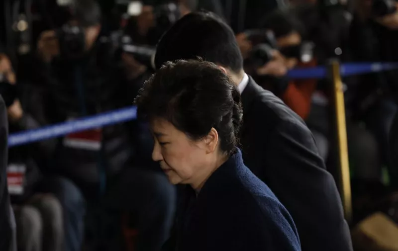 South Korea's ousted leader Park Geun-hye arrives at a prosecutor's office in Seoul on March 21, 2017.
Ousted South Korean president Park Geun-Hye reported to prosecutors on March 21 for questioning over the corruption and abuse of power scandal that brought her down, after using executive privilege to avoid them for months while in office. / AFP PHOTO / KIM HONG-JI