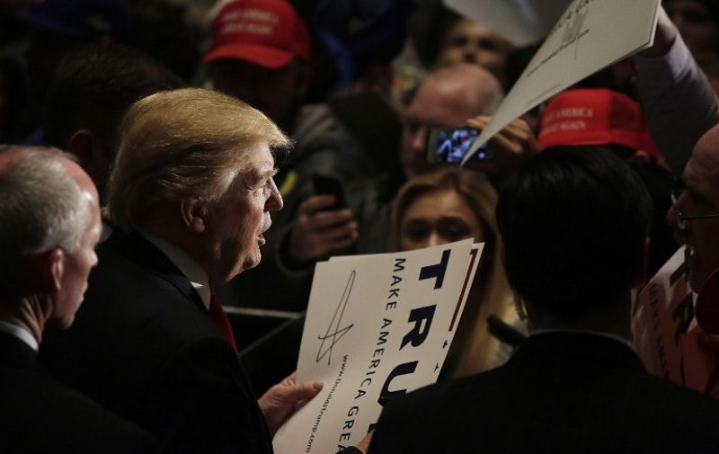 CEDAR RAPIDS, IA - FEBRUARY 1 : Republican presidential candidate Donald Trump greets people during a campaign event at the U.S. Cellular Convention Center February 1, 2016 in Cedar Rapids, Iowa. Trump who is seeking the nomination for the Republican Party attends his final campaign rally ahead of tonight's Iowa Caucus.   Joshua Lott/Getty Images/AFP