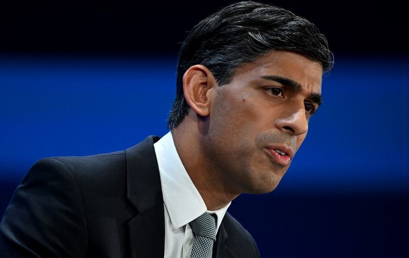 Britain's Prime Minister Rishi Sunak addresses delegates at the annual Conservative Party Conference in Manchester, northern England, on October 4, 2023. (Photo by JUSTIN TALLIS / AFP)