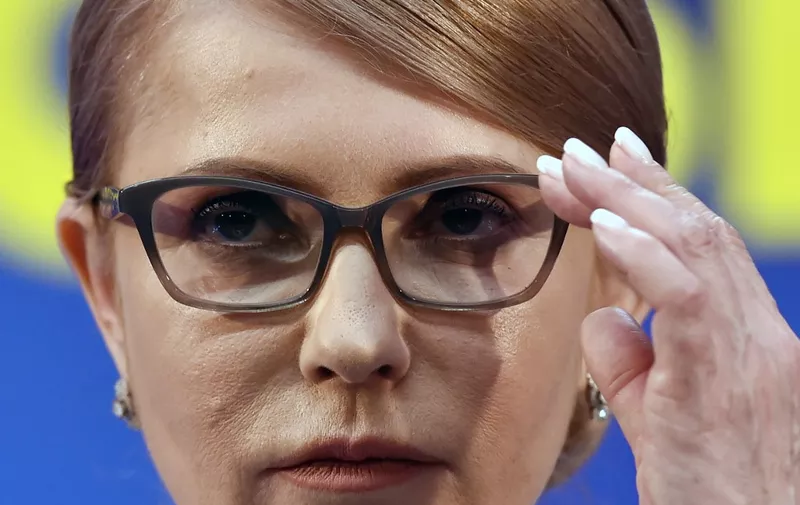Former Ukrainian Prime Minister and presidential candidate Yulia Tymoshenko adjusts her glasses as she prepares to deliver a speech at her campaign headquarters in Kiev, after the first round of Ukraine's presidential election, on March 31, 2019. - Comedian and political novice Volodymyr Zelensky topped the first round of Ukraine's presidential election on Sunday, exit polls showed, leading incumbent Petro Poroshenko into a run-off. (Photo by Sergei GAPON / AFP)
