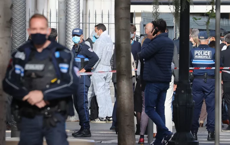 French forensics officers arrive at the site of a knife attack in Nice on October 29, 2020. A man wielding a knife outside a church in the southern French city of Nice slit the throat of one person, leaving another dead and injured several others in an attack on Thursday morning, officials said. The suspected assailant was detained shortly afterwards, a police source said, while interior minister Gerald Darmanin said on Twitter that he had called a crisis meeting after the attack. (Photo by Valery HACHE / AFP)