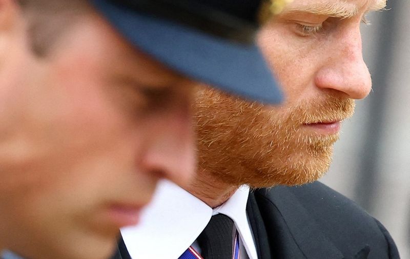 (FILES) In this file photo taken on September 19, 2022 Britain's Prince William, Prince of Wales (L) and Britain's Prince Harry, Duke of Sussex (R) attend the State Funeral of Britain's Queen Elizabeth II in London. - Britain's Prince Harry recounts in his new book how he was physically "attacked" by his older brother Prince William during an argument in 2019, the Guardian reported on January 4, 2023. (Photo by HANNAH MCKAY / POOL / AFP)