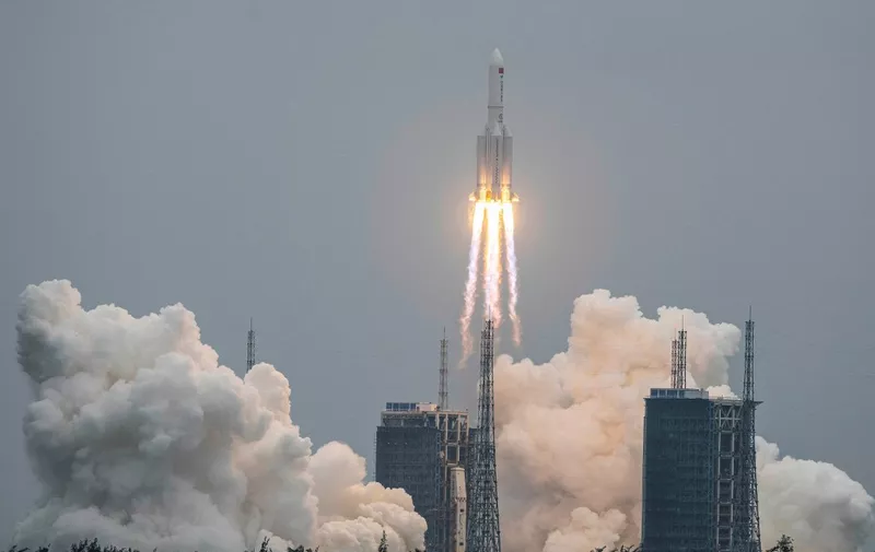 A Long March 5B rocket, carrying China's Tianhe space station core module, lifts off from the Wenchang Space Launch Center in southern China's Hainan province on April 29, 2021. (Photo by AFP) / China OUT