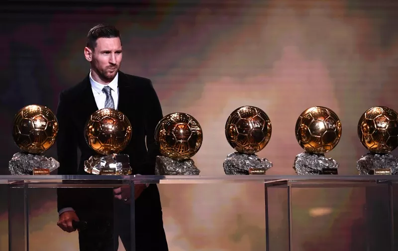 Barcelona's Argentinian forward Lionel Messi reacts after winning the Ballon d'Or France Football 2019 trophy at the Chatelet Theatre in Paris on December 2, 2019. - Lionel Messi won a record-breaking sixth Ballon d'Or on Monday after another sublime year for the Argentinian, whose familiar brilliance remained undimmed even through difficult times for club and country. (Photo by FRANCK FIFE / AFP)