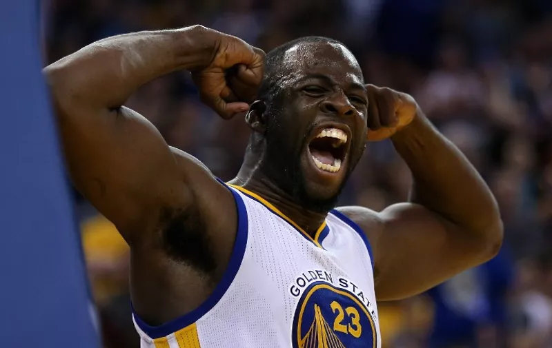 OAKLAND, CA - APRIL 03: Draymond Green #23 of the Golden State Warriors reacts after he made a basket and was fouled during their game against the Portland Trail Blazers at ORACLE Arena on April 3, 2016 in Oakland, California. NOTE TO USER: User expressly acknowledges and agrees that, by downloading and or using this photograph, User is consenting to the terms and conditions of the Getty Images License Agreement.   Ezra Shaw/Getty Images/AFP