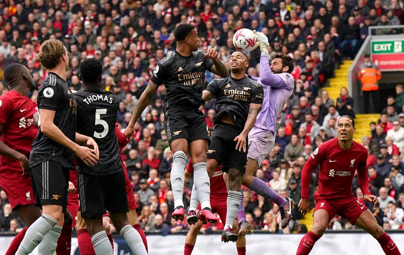 Liverpool, England, 9th April 2023. Alisson Becker of Liverpool collects the ball off the head of Gabriel Jesus of Arsenal during the Premier League match at Anfield, Liverpool. Picture credit should read: Andrew Yates / Sportimage EDITORIAL USE ONLY. No use with unauthorised audio, video, data, fixture lists, club/league logos or live services. Online in-match use limited to 120 images, no video emulation. No use in betting, games or single club/league/player publications. SPI-2358-0043