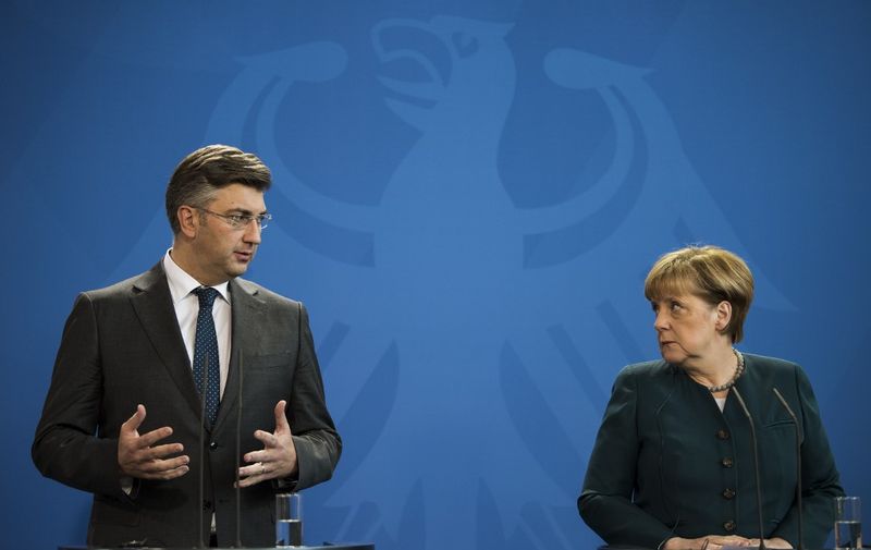 German Chancellor Angela Merkel (R) and Croatian prime minister Andrej Plenkovic give a joint press conference following a meeting at the Chancellery in Berlin on December 12, 2016. (Photo by Odd ANDERSEN / AFP)