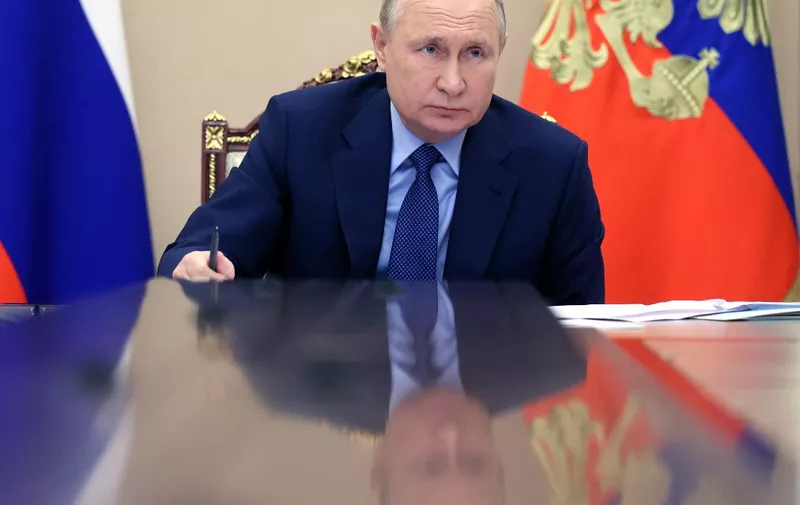 Russian President Vladimir Putin chairs a meeting via teleconference on the situation of coal mining enterprises in Kuzbass, at the Kremlin in Moscow, on DEcember 2, 2021. (Photo by Mikhail Metzel / SPUTNIK / AFP)