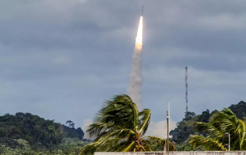 A Vega rocket lifts off from the ESA's base in Kourou, French Guiana on February 11, 2015, bearing the Intermediate eXperimental Vehicle (IXV) on a 100-minute test mission. The European Space Agency (ESA) said it had launched a prototype craft designed to return to Earth at the end of its mission, a key goal in space strategy.  The sub-orbital mission will test technologies that ESA hopes will lead to a reusable spacecraft.
AFP PHOTO / JODY AMIET (Photo by JODY AMIET / AFP)