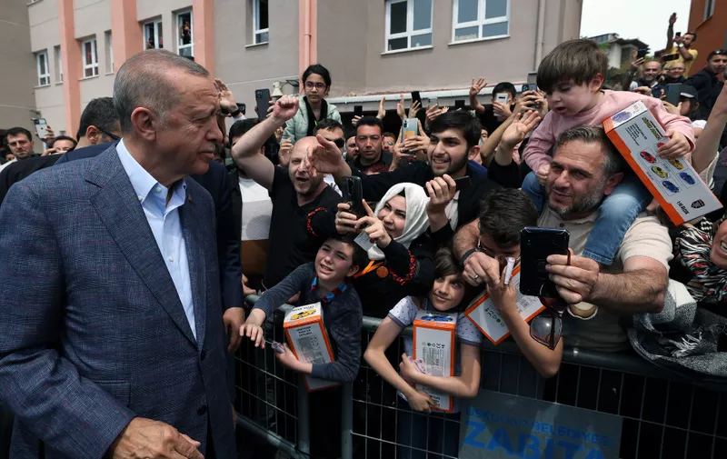 ISTANBUL, May 14, 2023  -- Turkish President Recep Tayyip Erdogan meets with supporters outside a polling station in Istanbul, T¨¹rkiye, May 14, 2023.
  Turkish citizens headed to the polls on Sunday for twin presidential and parliamentary elections that could shape the Turkish political landscape for the upcoming years.
   Some 61 million voters are registered to cast their ballots. Around 3.5 million voters living abroad have been called to cast their votes in advance. More than 1.76 million Turks abroad have cast their votes at diplomatic missions and customs gates between April 27 and May 9.,Image: 775825967, License: Rights-managed, Restrictions: , Model Release: no