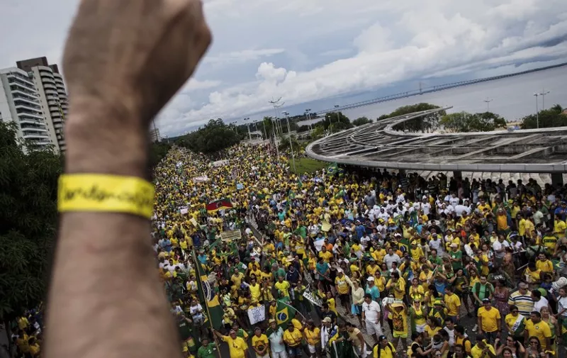 Thousands of demonstrators protest against Brazilian President Dilma Rousseff, the federal government, ex-president Luiz Inacio Lula da Silva  and the corruption cases being reported and currently investigated on March 13, 2016 in Manaus, Amazonas, northern Brazil. Some three million Brazilians enraged at corruption, recession and demanding the removal of leftist President Dilma Rousseff demonstrated across Latin America's biggest nation Sunday.   AFP PHOTO/ Raphael ALVES / AFP / RAPHAEL ALVES