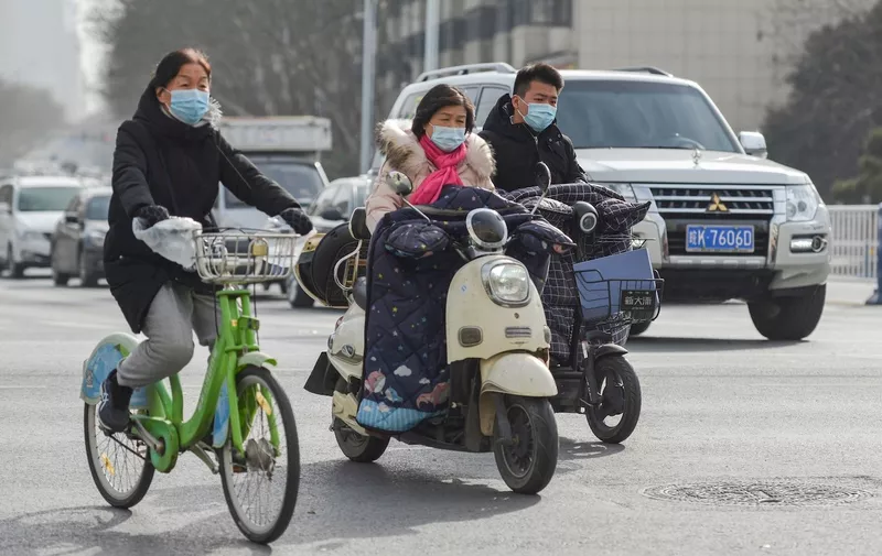 People wearing face masks as a preventive measure against the spread of coronavirus ride electric scooters and bicycle.
The WHO (World Health Organization) team of international researchers that arrived in the central Chinese city of Wuhan on Thursday hopes to find clues to the origin of the COVID-19 pandemic.
Daily Life in Fuyang, China - 15 Jan 2021,Image: 583602672, License: Rights-managed, Restrictions: , Model Release: no