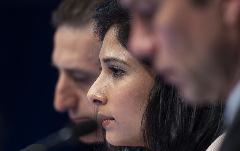 Chief Economist and Director of the Research Department at the International Monetary Fund (IMF), Gita Gopinath (C), looks on during a press conference in Washington, DC on April 9, 2019. - The world's largest economy is now expected to expand at a 2.3 percent clip this year, down from the 2.5 percent expected in January, but still relatively strong, according to the report released ahead of this week's spring meetings of the IMF and World Bank. (Photo by Andrew CABALLERO-REYNOLDS / AFP)