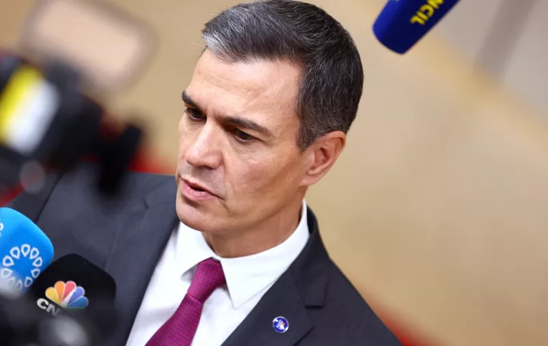 Spain's Prime Minister Pedro Sanchez addresses the press as he arrives for a EU leaders Summit at The European Council Building in Brussels on October 26, 2023. EU leaders will debate starting October 26, 2023, in a two day summit in Brussels, for a call for humanitarian "pauses" in Israel's war with Hamas, as the bloc grapples with another conflict on its fringes alongside Russia's invasion of Ukraine. (Photo by Kenzo TRIBOUILLARD / AFP)
