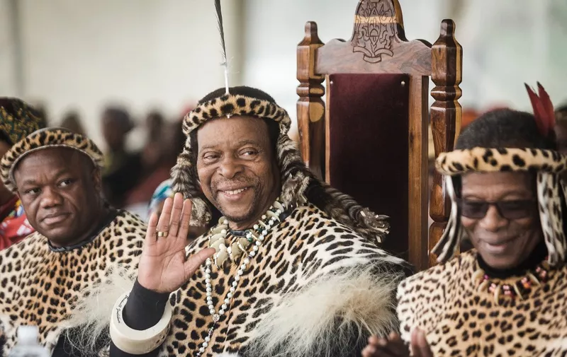 Zulu King Goodwill Zwelithini ka Bhekuzulu (2ndL) and senior Prince of the Zulu Nation and former leader of the Inkatha Freedom Party ( IFP ) Prince Mangosuthu Buthelezi (R) join thousands of people to commemorate King Shaka's Day Celebration near the grave of the great Zulu King Shaka at Kwadukuza, some 98 kilometres north of Durban, on September 24, 2019. - The celebration was also to commemorate national Heritage day. (Photo by RAJESH JANTILAL / AFP)