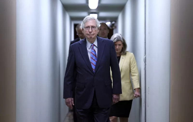 WASHINGTON, DC - SEPTEMBER 28: U.S. Senate Minority Leader Mitch McConnell (R-KY) walks to speak to reporters following a Senate Republican luncheon at the U.S. Capitol on September 28, 2022 in Washington, DC. McConnell spoke on the Republican agenda for the upcoming midterm elections. McConnell was followed by Sen. Jonie Ernst (R-IA) (R) and Sen John Thune (R-SD).   Kevin Dietsch/Getty Images/AFP (Photo by Kevin Dietsch / GETTY IMAGES NORTH AMERICA / Getty Images via AFP)