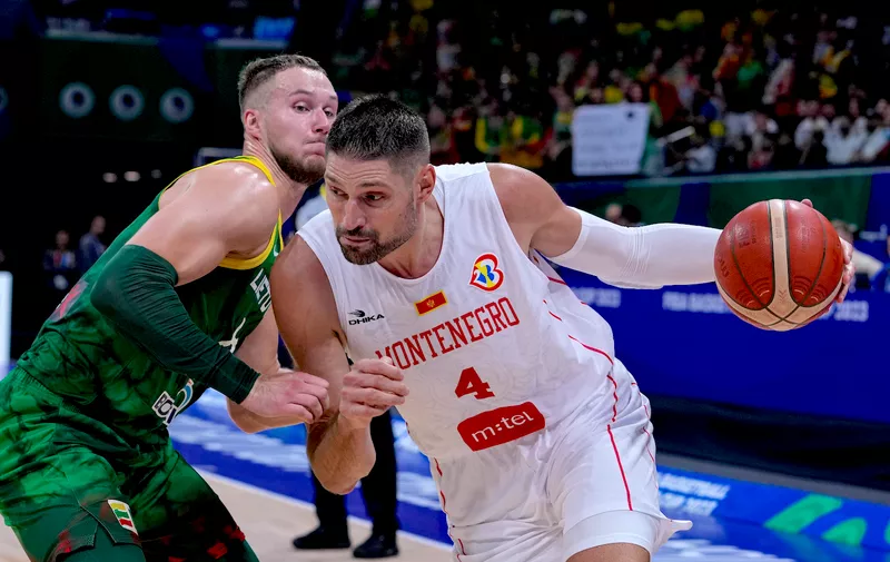Montenegro center Nikola Vucevic (4) drives on Lithuania forward Tadas Sedekerskis (8) during the second half of a Basketball World Cup group D match in Manila, Philippines Tuesday, Aug. 29, 2023. Lithuania defeated Montenegro 91-71. (AP Photo/Michael Conroy)