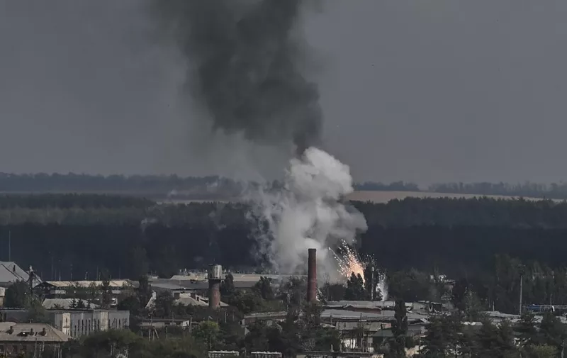 A photo shows an explosion in the village of Kupiansk in eastern Ukraine, in September 17, 2022, amid the Russian invasion of Ukraine. (Photo by Juan BARRETO / AFP)