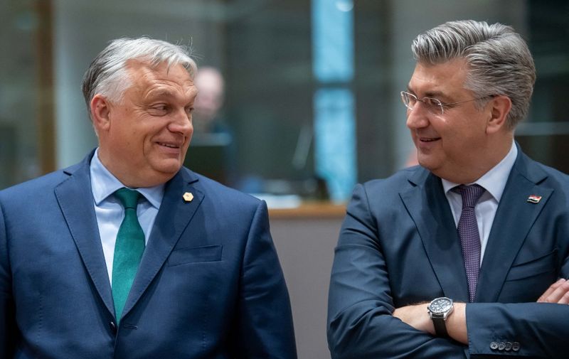 BRUSSELS - Prime Minister of Hungary Viktor Orban and Prime Minister of Croatia Andrej Plenkovic at the round table during the informal EU summit. During the meeting, discussions will include the results of the European elections and the filling of top positions. ANP JONAS ROOSENS netherlands out - belgium out (Photo by JONAS ROOSENS / ANP MAG / ANP via AFP)