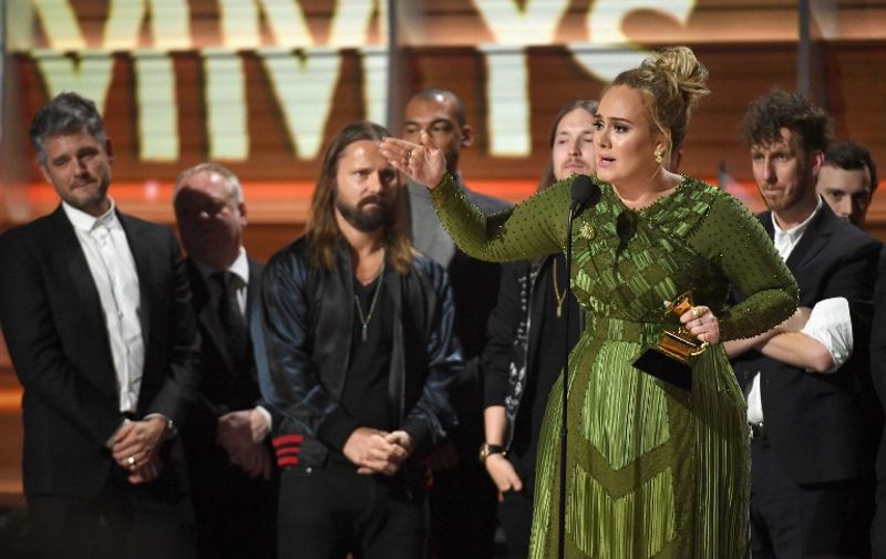 LOS ANGELES, CA - FEBRUARY 12: Recording artist Adele, winner of Album of the Year for '25,' speaks onstage during The 59th GRAMMY Awards at STAPLES Center on February 12, 2017 in Los Angeles, California.   Kevork Djansezian/Getty Images/AFP