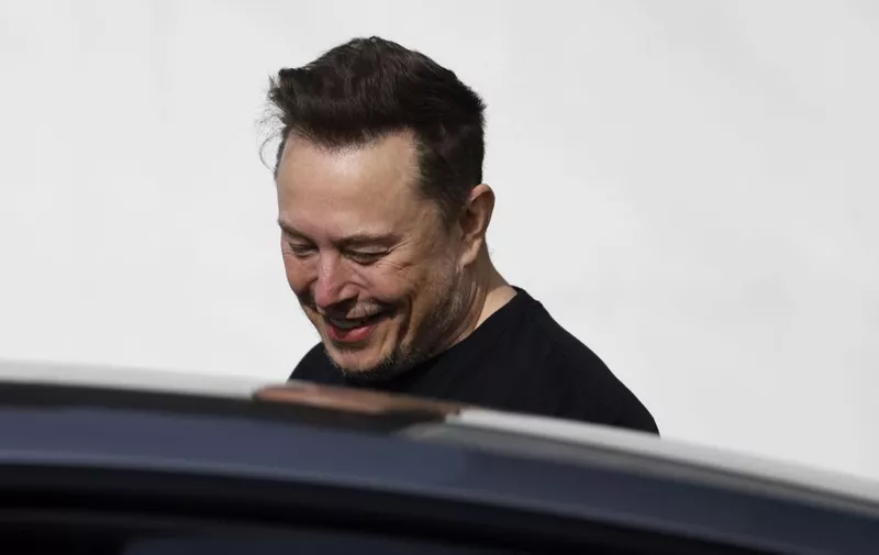 Tesla CEO Elon Musk is pictured during a visit at the company's electric car plant in Gruenheide near Berlin, eastern Germany, on March 13, 2024, as employees resumed work after production had to be halted due to a suspected arson attack that caused a power outage. Damage to the lines knocked out power to the plant as well as cutting electricity to surrounding villages since power lines supplying the factory were set on fire in the early hours of March 5, 2024. Far-left activists from the "Vulkangruppe" (Volcano Group) have claimed responsibility for the sabotage, saying they aimed to achieve "the biggest possible blackout of the gigafactory", a reference to the Tesla plant. (Photo by Odd ANDERSEN / AFP)