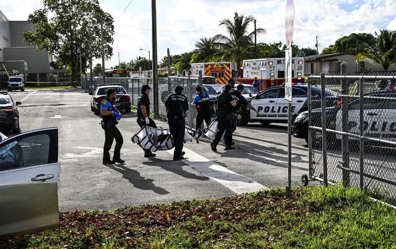 Hialeah Fire Department and Miami-Dade Schools Police Officers perform a rescue operation while participating in a Large-Scale Functional Active Shooter Drill at Hialeah Senior High School in Hialeah, Florida, on August 3, 2022. (Photo by CHANDAN KHANNA / AFP)