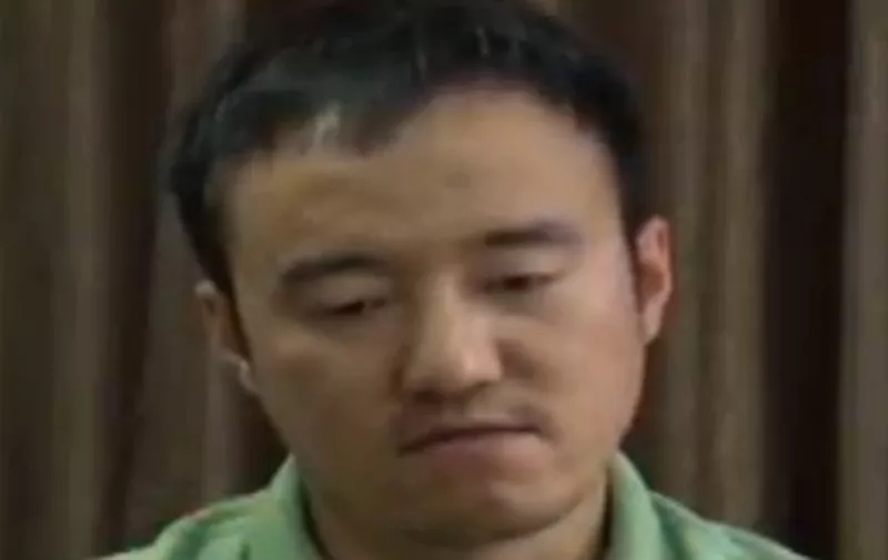 This screen grab taken from a CCTV footage shows Wang Xiaolu, a financial journalist with the respected business magazine Caijing, confessing on China's main state broadcaster on August 31, 2015. China's main state broadcaster on August 31 paraded Wang Xiaolu "confessing" to causing the stock market "great losses" as authorities seek to rein in a rout on the exchanges. AFP PHOTO / CCTV 
 ----EDITORS NOTE---- RESTRICTED TO EDITORIAL USE - MANDATORY CREDIT "AFP PHOTO / CCTV" - NO MARKETING NO ADVERTISING CAMPAIGNS - DISTRIBUTED AS A SERVICE TO CLIENTS