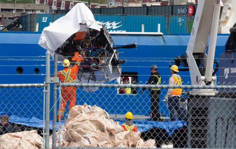 Debris from the Titan submersible, recovered from the ocean floor near the wreck of the Titanic, is unloaded from the ship Horizon Arctic at the Canadian Coast Guard pier in St. John's, NL, Canada, on Wednesday, June 28, 2023.,Image: 785856069, License: Rights-managed, Restrictions: , Model Release: no